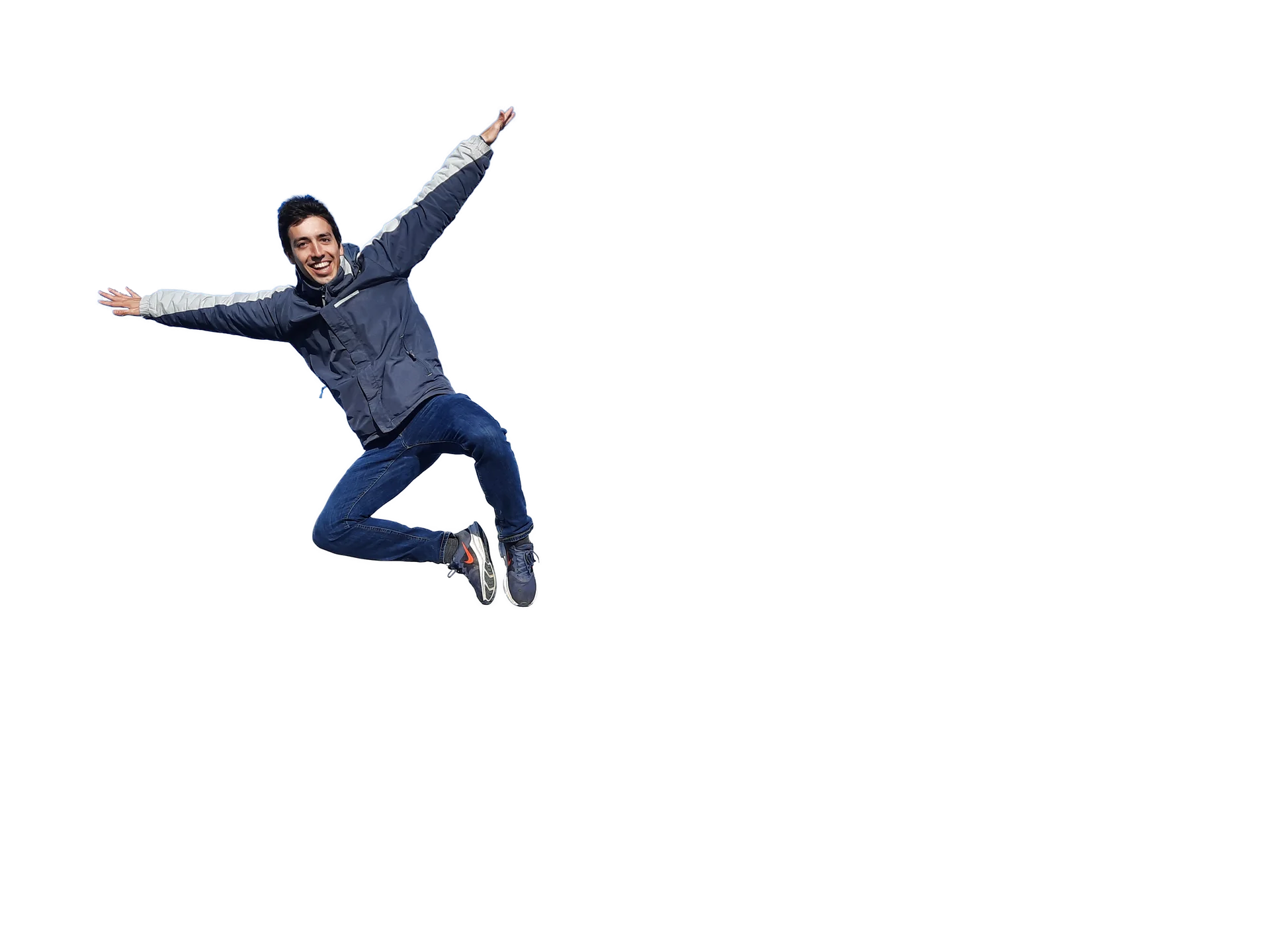Rafael Correia jumping in the air on a mountain ridge